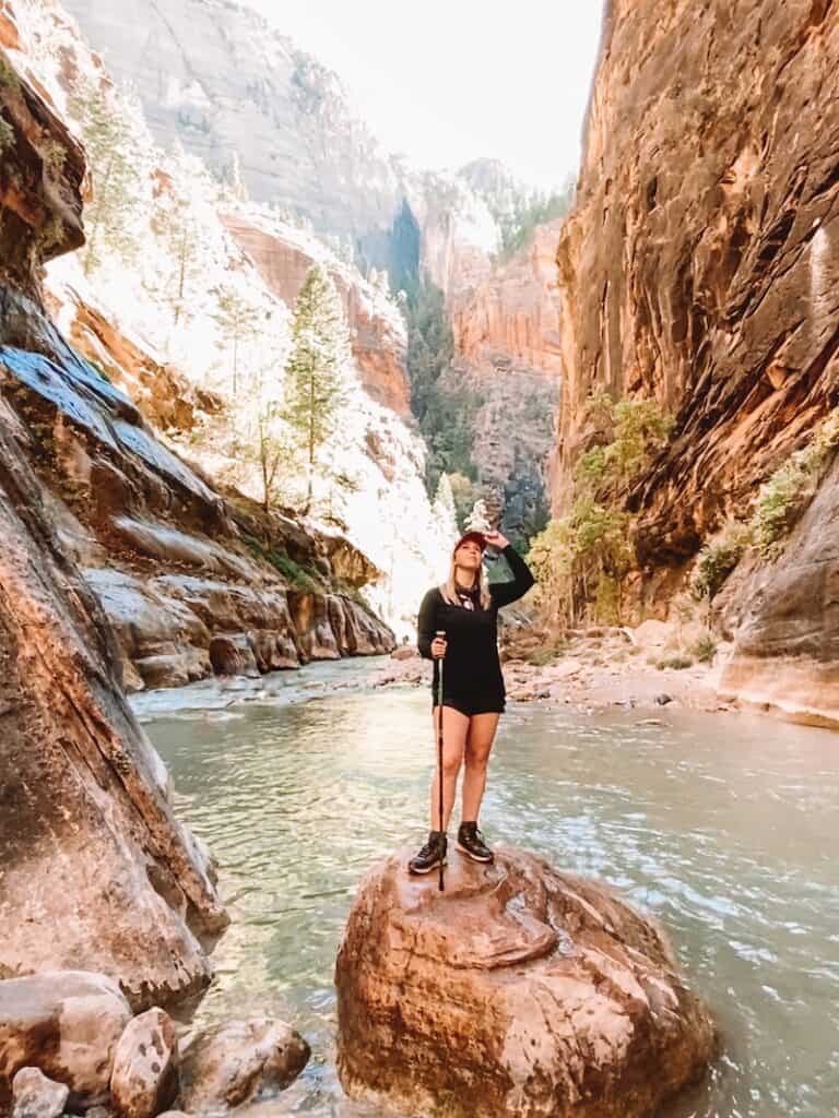 A hiker exploring the Narrows in Zion National Park