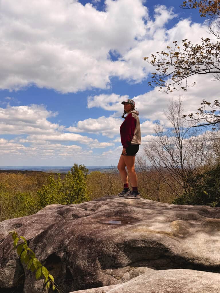 enjoying the sunshine on Beam Rocks during a thru-hike of the Laurel Highlands Hiking Trail