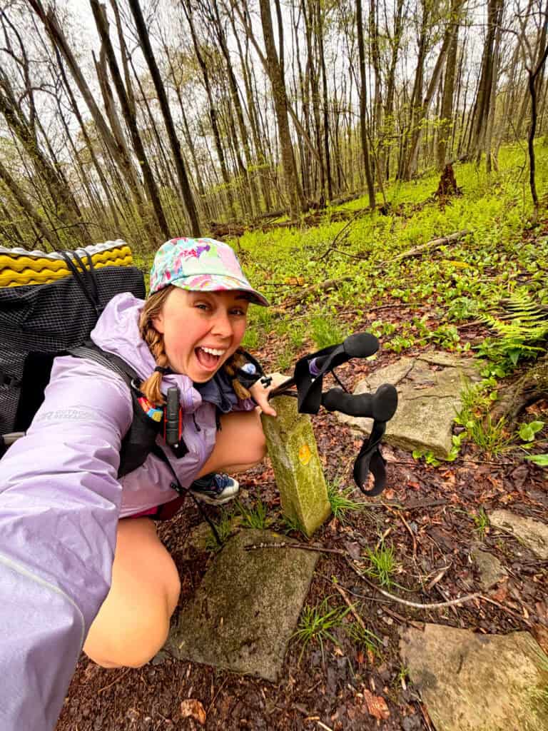 Posing with the Mile 9 marker on the Laurel Highlands Hiking Trail