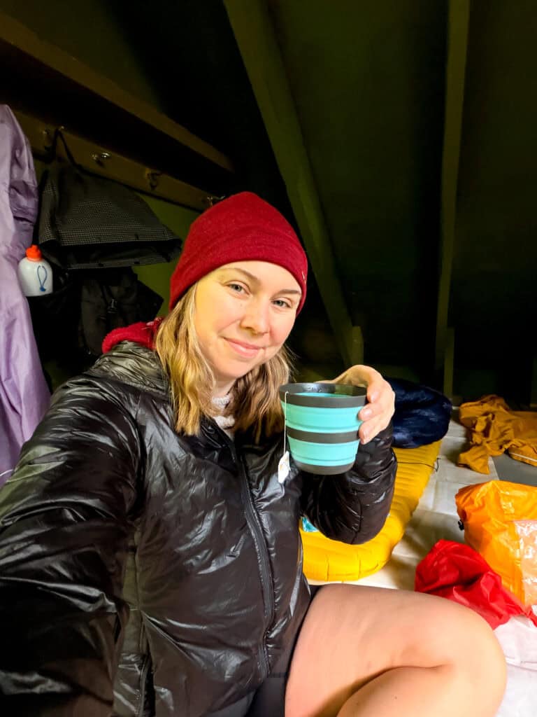Enjoying some hot tea on a cozy afternoon in a Laurel Highlands shelter